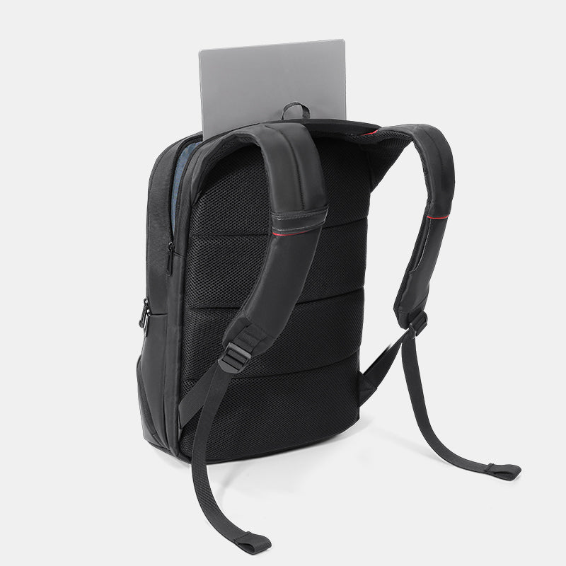 Black backpack with a gray tablet on a white background