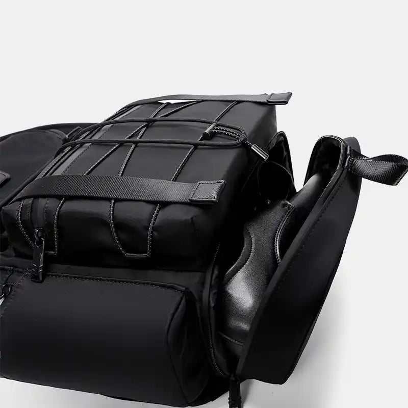 Black backpack with straps on a white background