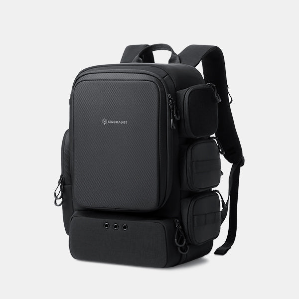 Black backpack with multiple compartments on a light gray background#color_black