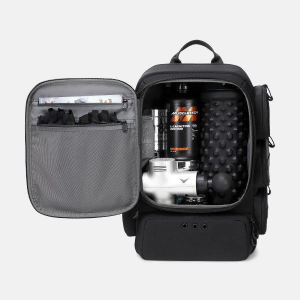 Black backpack with open compartment showing gym equipment on a light gray background