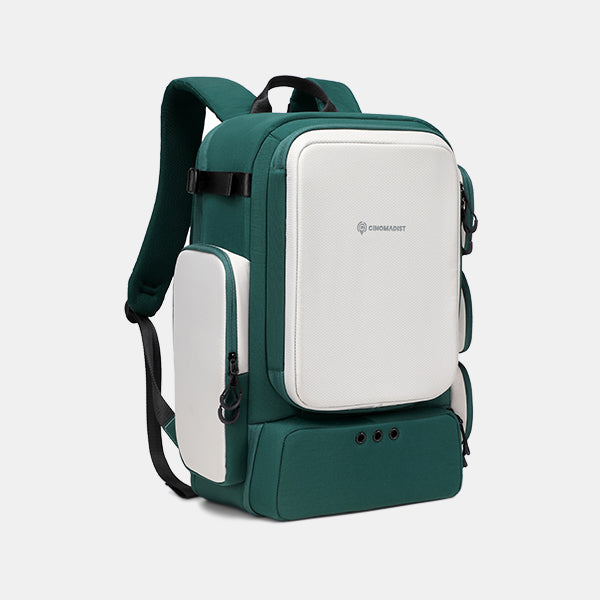 Green and white backpack with a visible brand logo on a light gray background#color_dark-teal