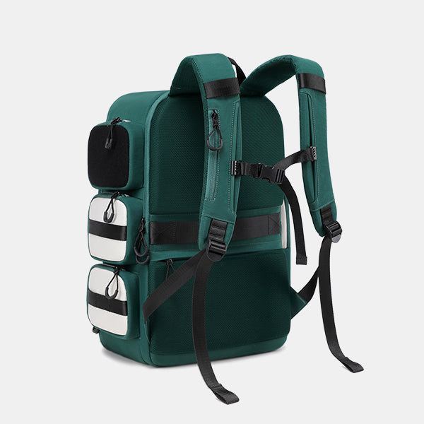 Green backpack with black straps on a light gray background