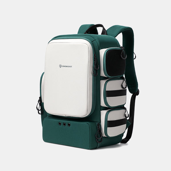 Green and white backpack with visible brand logo on a light gray background