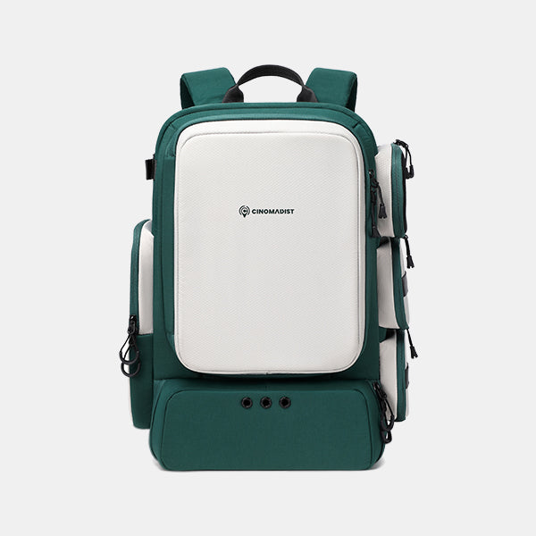 Green and white backpack with Cinomadist branding on a light gray background