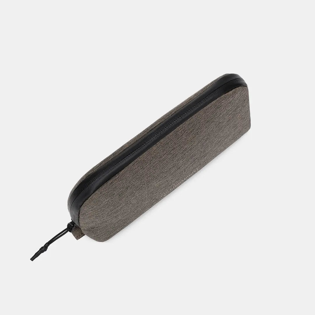 Slim side view of the brown tech pouch from Cinomadist