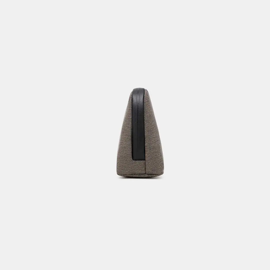 Side profile of Cinomadist tech pouch in brown