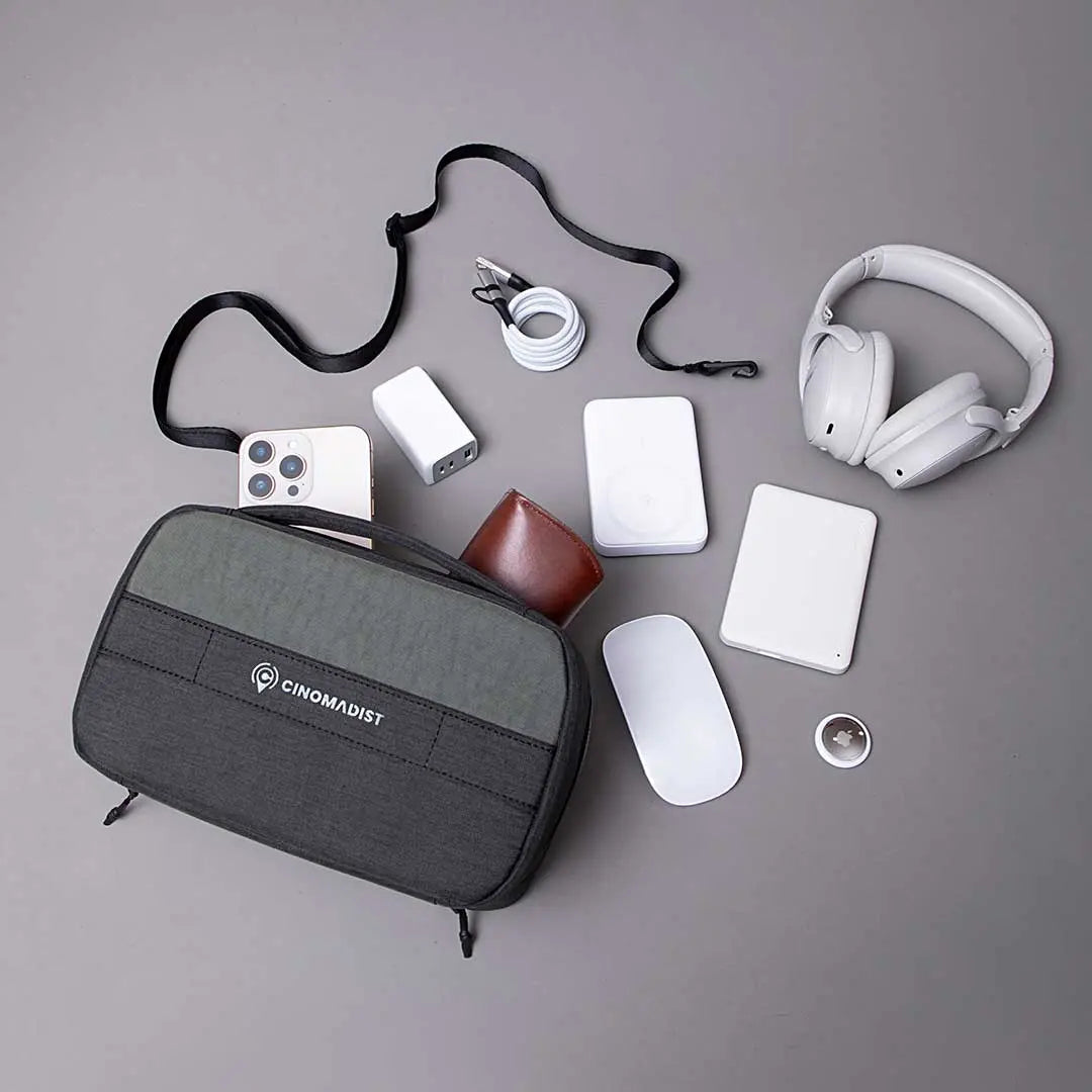 Cinomadist tech pouch with neatly organized tech accessories like cables, charger, headphones, and mouse.