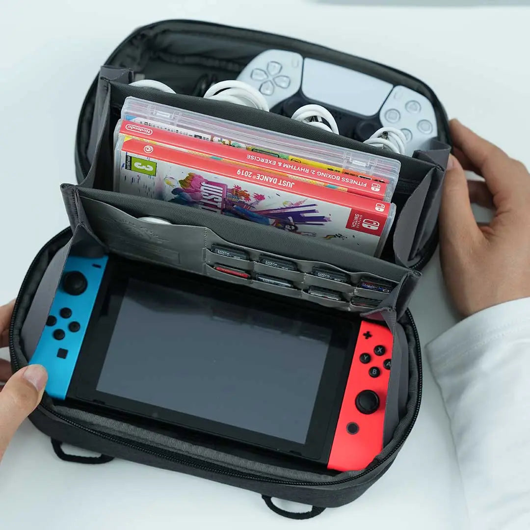 Travel tech pouch by Cinomadist holding a Nintendo Switch, memory cards, and gaming accessories.