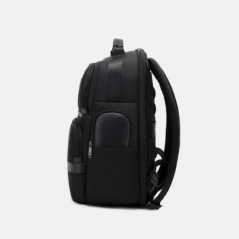 Black backpack on a light gray background