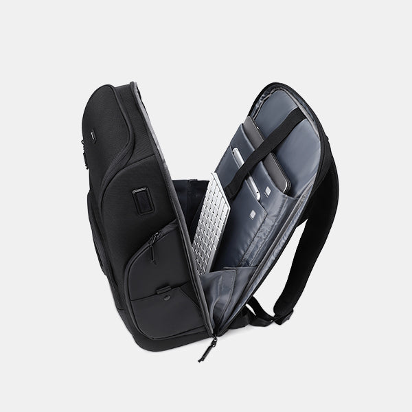 Black backpack with a laptop compartment on a light gray background