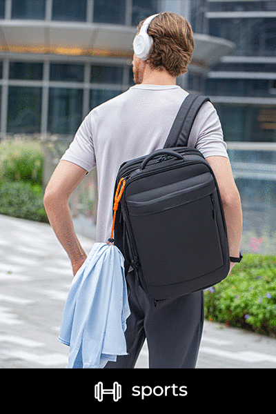 A man sightseeing while wearing a backpack.