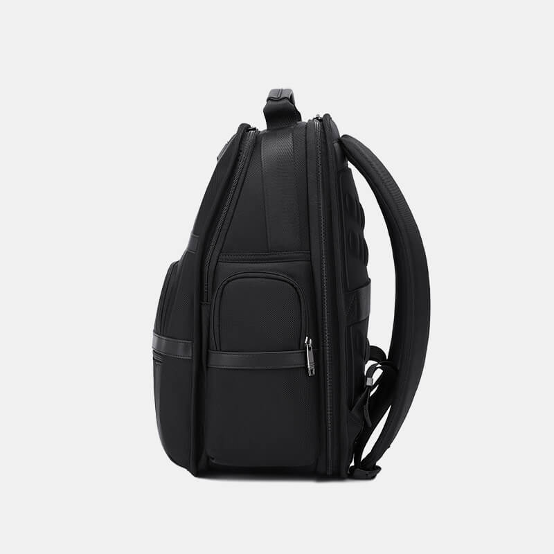 Black backpack on a light gray background