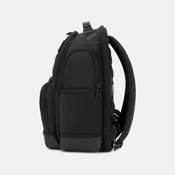 Black backpack on a light gray background