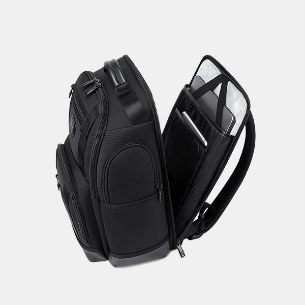 Black backpack with a laptop compartment on a light gray background