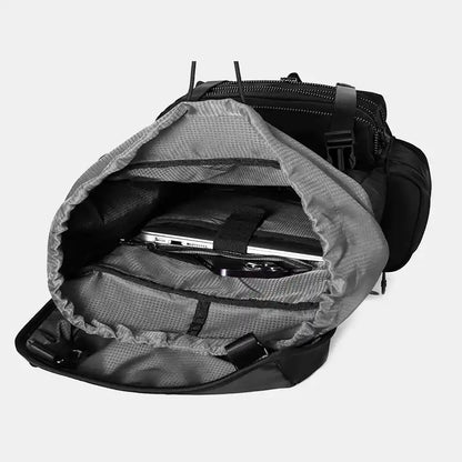 Gray backpack with a laptop compartment on a light gray background