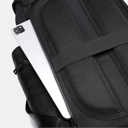 Black backpack with a laptop compartment on a white background