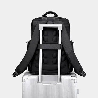 Black backpack with a built-in rolling handle on a white background