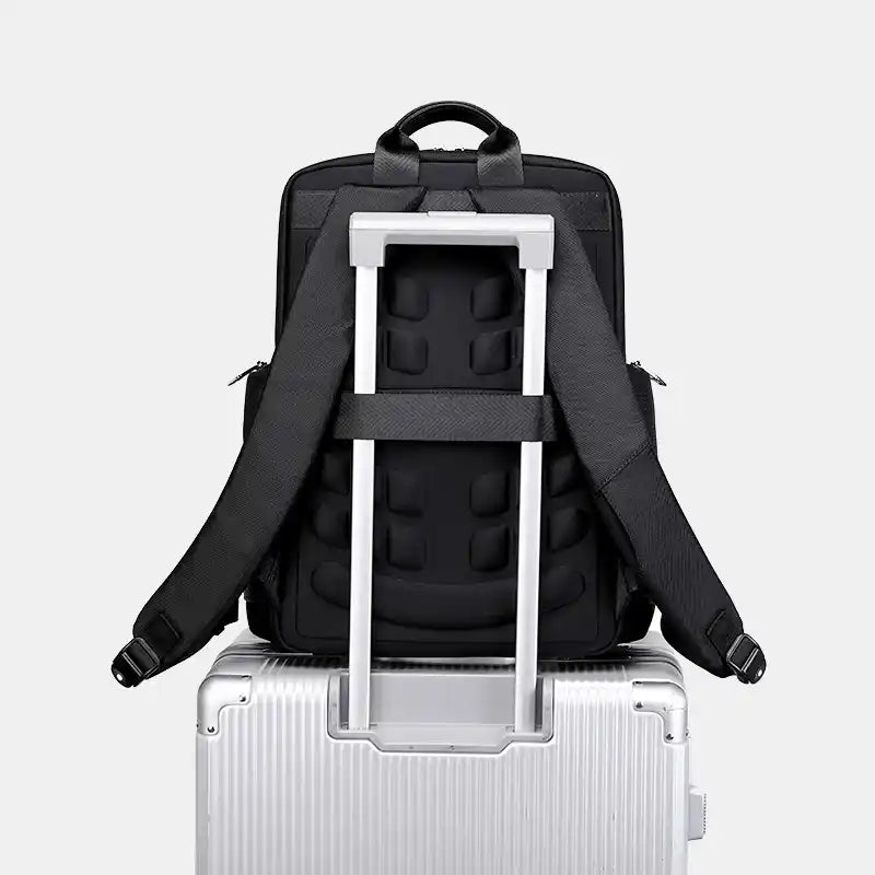 Black backpack with a built-in rolling handle on a white background