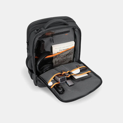 Front compartment of the Travel Expandable Backpack Pro highlighting multi-functional pocket partitioning and tech-pouch organization for everyday carry.