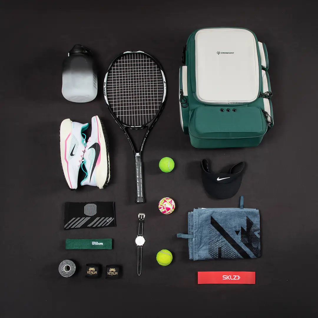 Green Cinomadist gym backpack flat lay with tennis racket, running shoes and training accessories