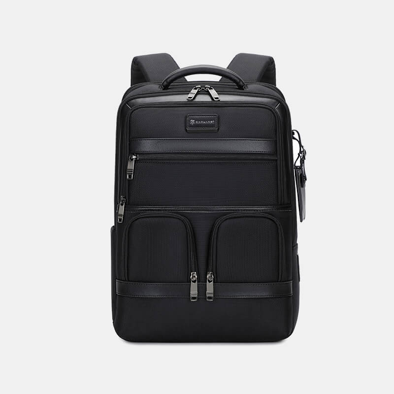 Black backpack with multiple pockets and zippers on a light gray background