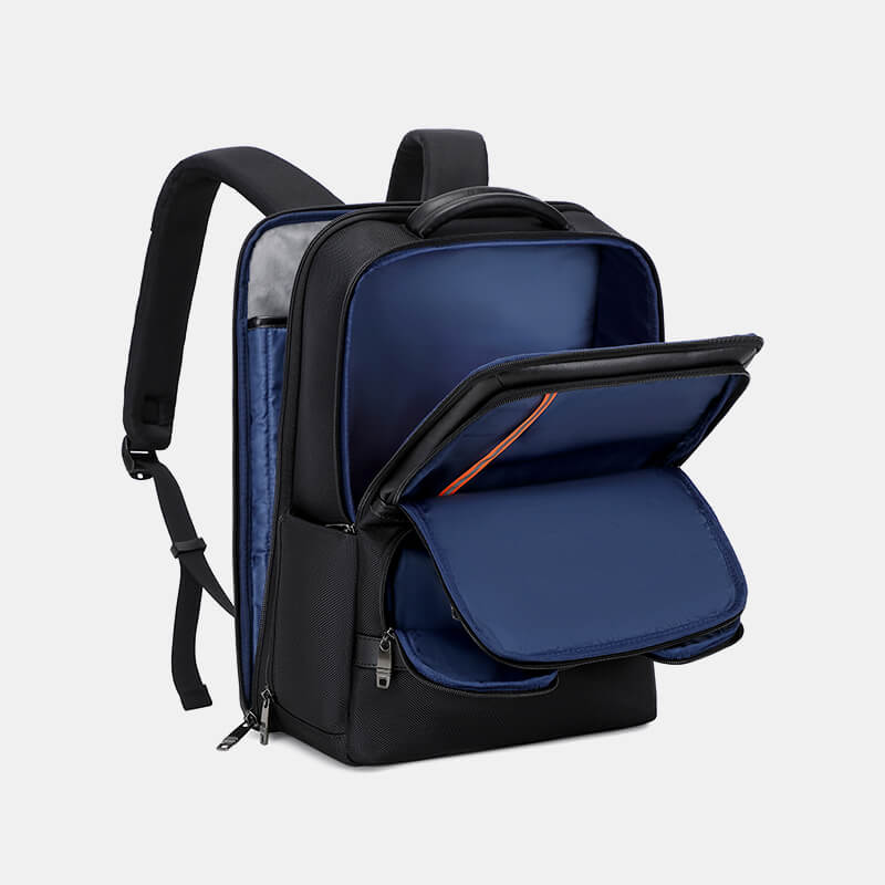 Black and blue backpack with open compartment on a light gray background
