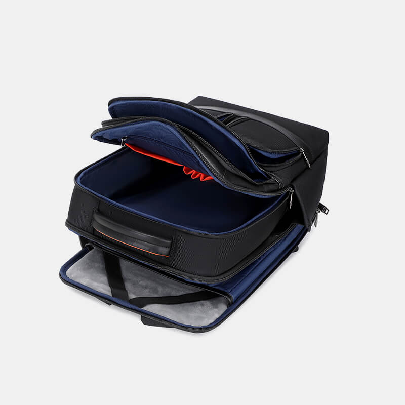 Black and blue suitcase with open compartment on a light gray background