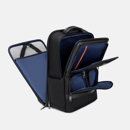 Black backpack with open compartments on a light gray background