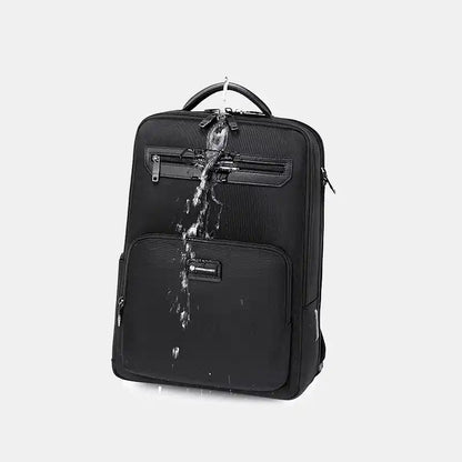 Black backpack with water splashes on a light gray background