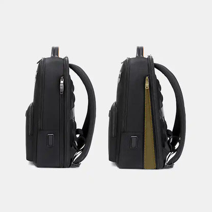 Two black backpacks with a gold zipper on a light gray background