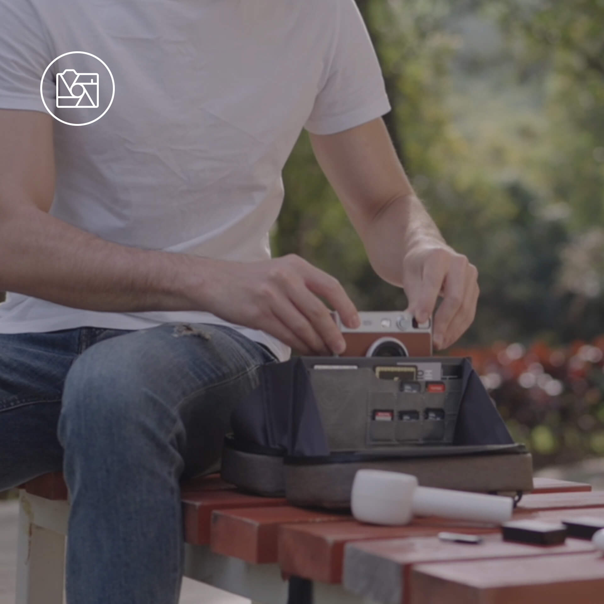 Taking out a digital camera from tech pouch to capture a special moment