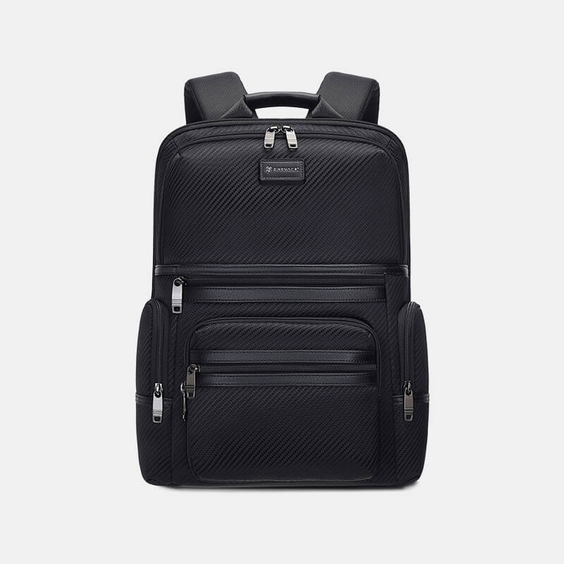 Black backpack with zippers on a light gray background