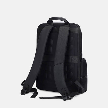 Black backpack on a light gray background