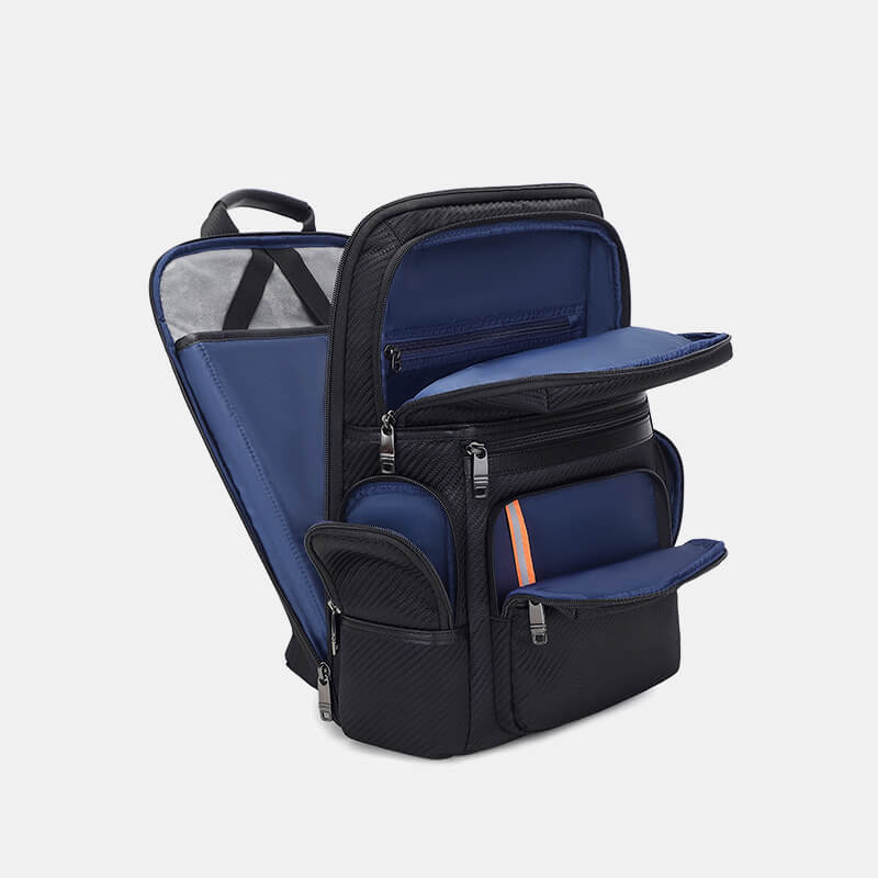 Blue and black backpack with open compartments on a light gray background