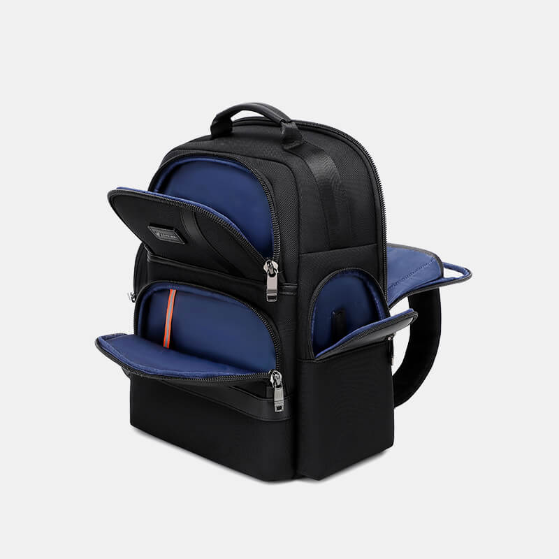 Black backpack with blue interior compartments on a light gray background