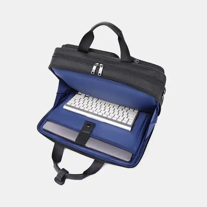 Laptop bag with a laptop and keyboard on a light gray background