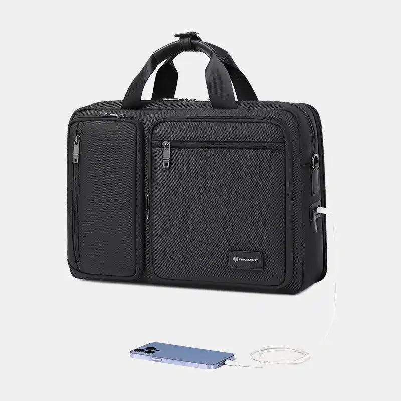 Black travel bag with a phone and charger on a light gray background