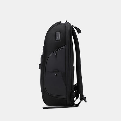 Black backpack on a light gray background