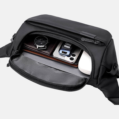 Tech compartment of Cinomadist crossbody bag with devices organized