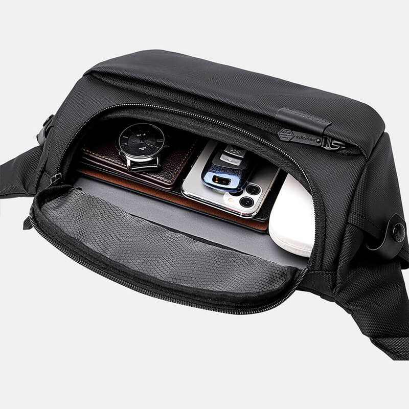 Tech compartment of Cinomadist crossbody bag with devices organized
