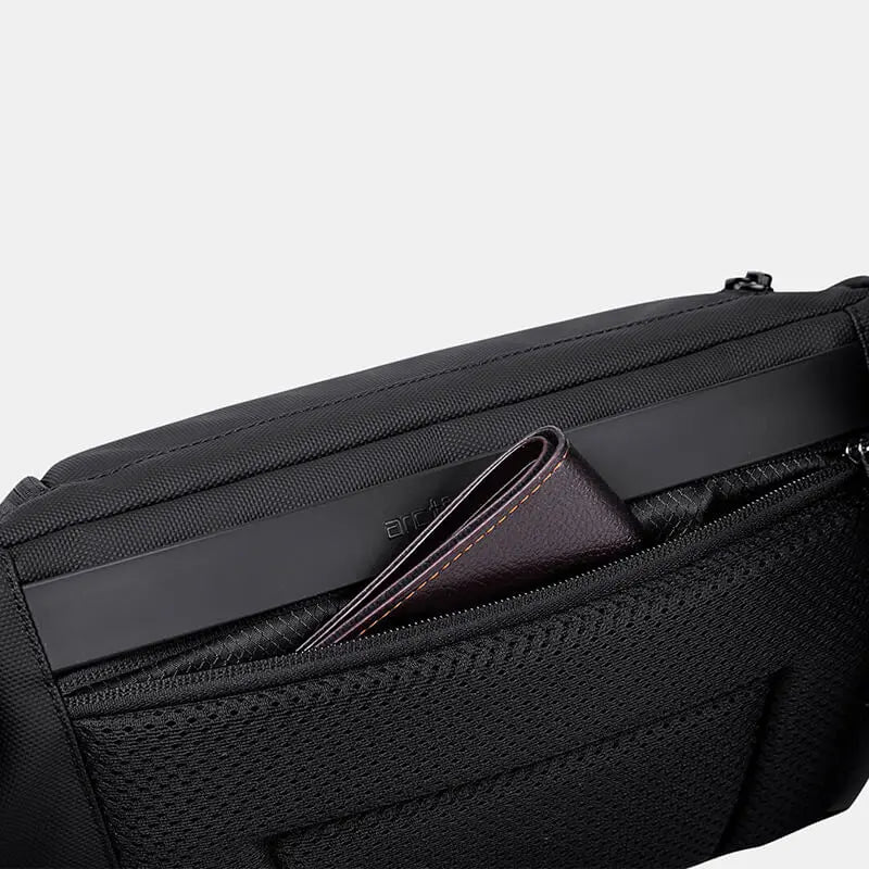 Back pocket view of Cinomadist crossbody bag storing a passport
