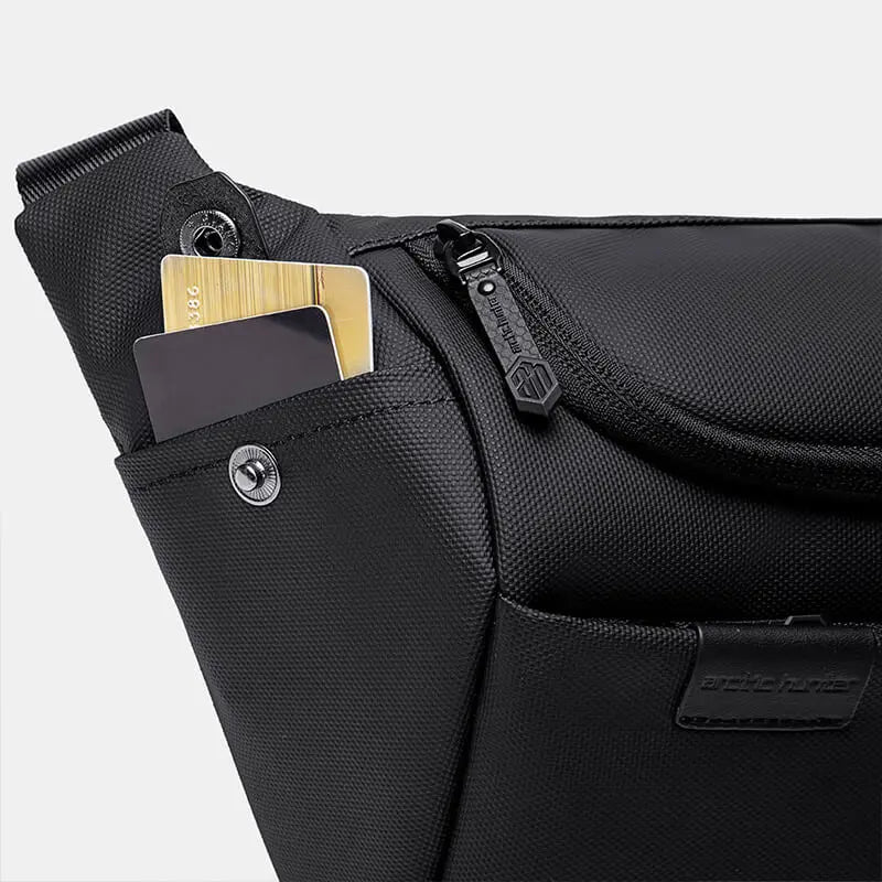 Quick-access side pocket of Cinomadist bag holding a phone