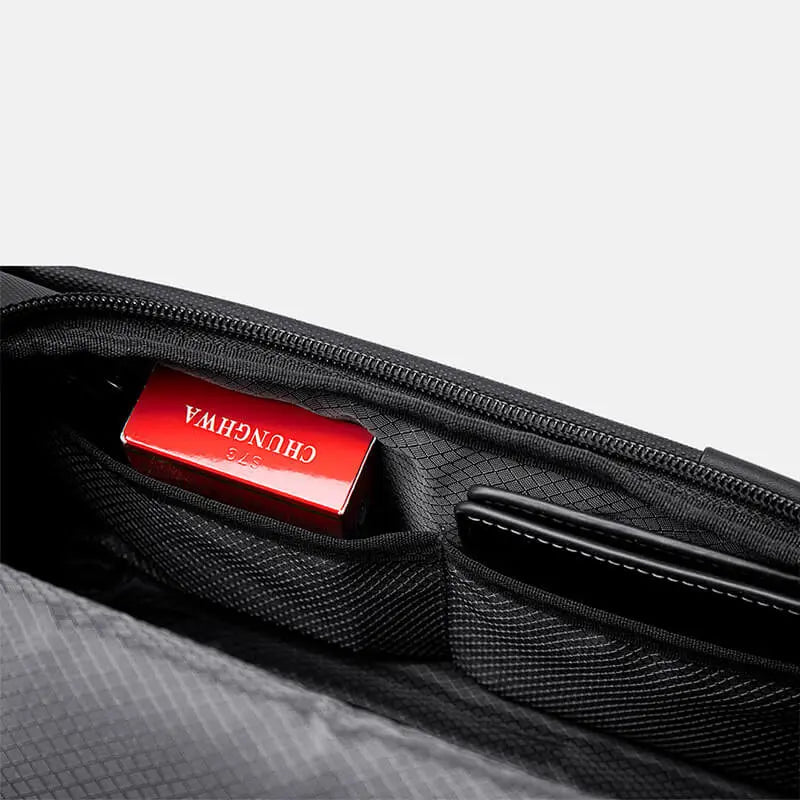 Hidden pocket inside Cinomadist bag with red memory card