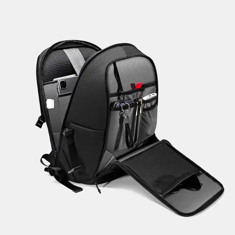 Black backpack with a laptop compartment on a light gray background