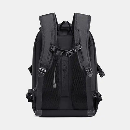 Black backpack shown from the back on a light gray background