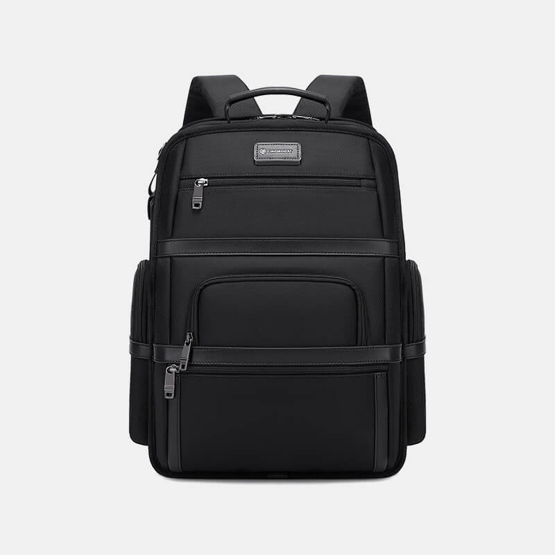 Black backpack with multiple compartments on a light gray background