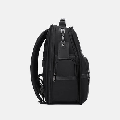 Black backpack on a light gray background