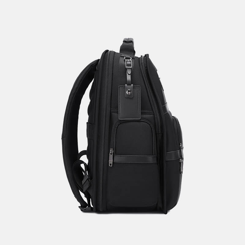 Black backpack on a light gray background