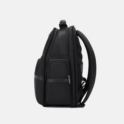 Black backpack on a light gray background