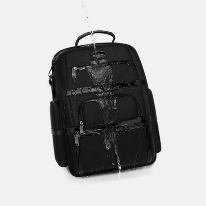 Black backpack with water splashes on a white background